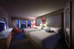 HTL Modern Hotel Room With Two Queen Beds At Dusk